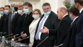 Prime Minister Mikhail Mishustin (third right) arrives at a cabinet meeting, June 2021 (Dmitry Astakhov/AP/Shutterstock)