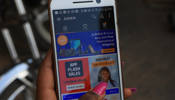 A Kenyan woman uses Jumia's mobile app in Nairobi, Kenya (Daniel Irungu/EPA-EFE/Shutterstock)