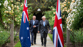 Britain's Prime Minister Boris Johnson, right, walks with Australian Prime Minister Scott Morrison in the garden of 10 Downing Street on June 15 (Dominic Lipinski/AP/Shutterstock)