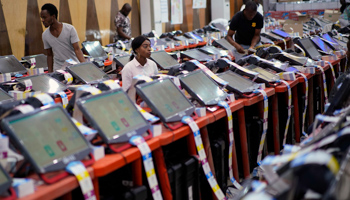 Government agents monitor the printing of ballots at the electoral commission's headquarters in Kinshasa, Congo (Jerome Delay/AP/Shutterstock)