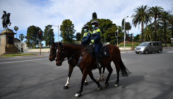 Mounted police on patrol in the central business district of Sydney, New South Wales (NSW), which is under a stay-at-home order, 26 July (Joel Carrett/EPA-EFE/Shutterstock)