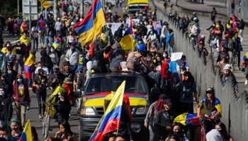 Demonstrators wave Colombian flags during Independence Day protests, July 20 (Mauricio Romero/LongVisual via ZUMA Press Wire/Shutterstock)