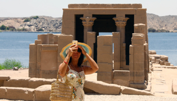 A tourist takes photos at the Philae temples on Agilia Island in Aswan (Chine Nouvelle/SIPA/Shutterstock)