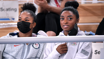 Simone Biles, right, and Jordan Chiles watch the women's individual all-around gymnastics final in Tokyo, July 29, 2021 (Wally Skalij/Los Angeles Times/Shutterstock)