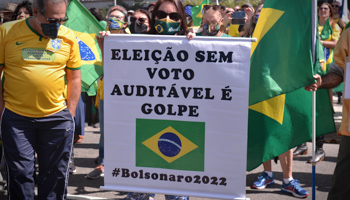 Bolsonaro supporters with a sign warning that "an election without auditable ballots is a coup" (Silvia Machado/via ZUMA Press Wire/Shutterstock)