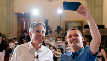 Secretary of State Antony Blinken, left, with French videographer Remy Buisine at a youth outreach event on democracy and human rights in Paris, June 25 (Andrew Harnik/AP/Shutterstock)