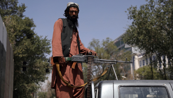 A Taliban footsoldier outside the presidential palace in Kabul, August 16, 2021 (Zabi Karimi/AP/Shutterstock)