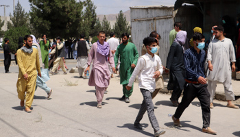 Afghans try to enter Kabul airport, Afghanistan (Bashir Darwish/UPI/Shutterstock)