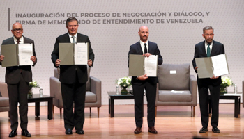 Government and opposition delegates, together with representatives of Mexico and Norway, at the inauguration of talks in Mexico (Mario Guzman/EPA-EFE/Shutterstock)