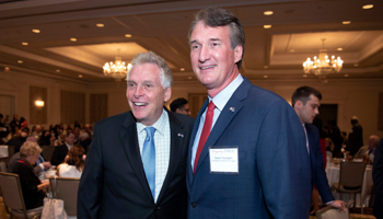 Democrat Terry McAuliffe left, and Republican Glenn Youngkin, candidates for governor of Virginia, pose together, September 1 (Cliff Owen/AP/Shutterstock)