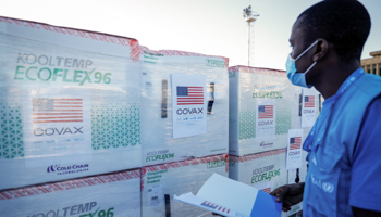 A worker checks a delivery of COVAX vaccines at Nairobi airport, August 23 (Brian Inganga/AP/Shutterstock)