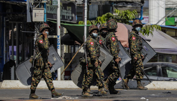 Military personnel patrolling the streets during an anti-coup protest (Lynn Bo Bo/EPA-EFE/Shutterstock)