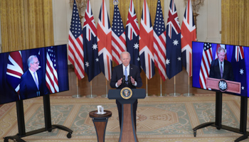 President Joe Biden, flanked by video links with Prime Ministers Scott Morrison and Boris Johnson, delivers remarks about AUKUS, September 15 (Shutterstock)