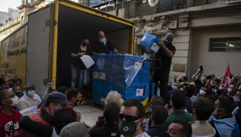 Supporters of a referendum deliver hundreds of boxes of signatures to the Electoral Court (Matilde Campodonico/AP/Shutterstock)
