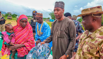 Borno State Governor Babagana Zulum welcomes freed Chibok school girl who was kidnapped by Boko Haram (Borno State House/AP/Shutterstock)