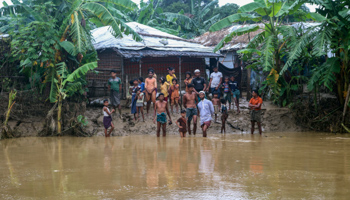 Rohingya at a flooded refugee camp in Bangladesh’s Cox’s Bazar district (Shafiqur Rahman/AP/Shutterstock)