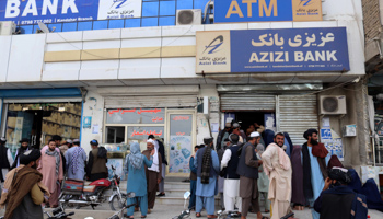 People queue to withdraw money from a bank in Kandahar, October 2 (Stringer/EPA-EFE/Shutterstock)