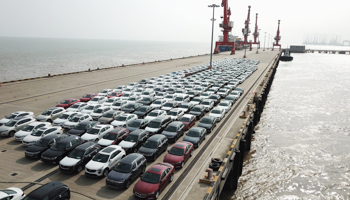 New cars wating for shipment at a port in the Lingang area in Shanghai, east China, 2019 (Xinhua/Shutterstock)