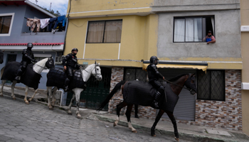 Mounted police patrol a street in Quito. October 27 (Dolores Ochoa/AP/Shutterstock)