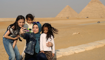 Tourists pose in front of the Giza Pyramids, October (Chine Nouvelle/SIPA/Shutterstock)