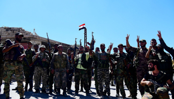 Pro-government fighters celebrate taking control in Deraa al-Balad, September 8, 2021 (Chine Nouvelle/SIPA/Shutterstock)
