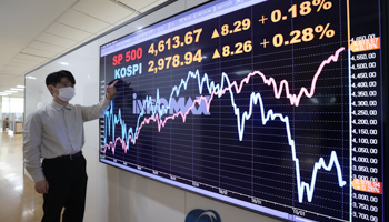 A monitor shows the KOSPI and S&P 500 indexes in Seoul, South Korea, November 2021 (YONHAP/EPA-EFE/Shutterstock)