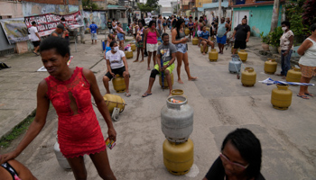 People waiting to buy low-cost cooking gas from the Petrobras Oil Tankers Union in Rio de Janeiro (Silvia Izquierdo/AP/Shutterstock)