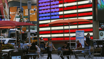 An illuminated US flag in Times Square, New York, August 12 (Jason Szenes/EPA-EFE/Shutterstock)