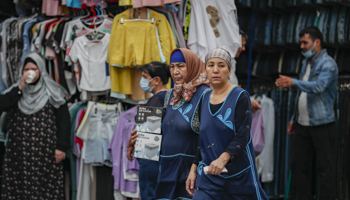 Central Asian migrants working at a market in Moscow (Yuri Kochetkov/EPA-EFE/Shutterstock)