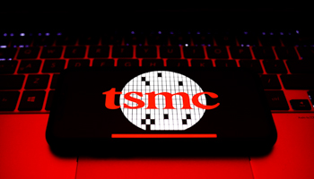 TSMC logo on a phone screen on a laptop keyboard (Photo by Jakub Porzycki/NurPhoto/Shutterstock)