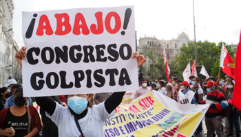 Supporters of President Pedro Castillo with banners accusing Congress of seeking to mount a coup (Carlos Garcia Granthon/ZUMA Press Wire/Shutterstock)