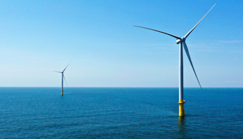Two offshore wind turbines constructed as part of a project off the Virginia coast, June 29, 2020 (Steve Helber/AP/Shutterstock)