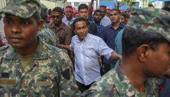 Former President Abdulla Yameen (centre) in early 2018, surrounded by bodyguards (Mohamed Sharuhaan/AP/Shutterstock)