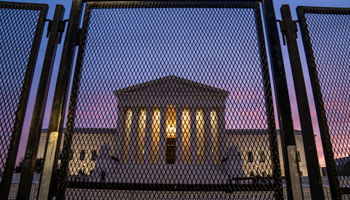 An eight foot high perimeter fence surrounds the Supreme Court building before President Biden’s inauguration, January 15, 2021 (Ken Cedeno/UPI/Shutterstock)