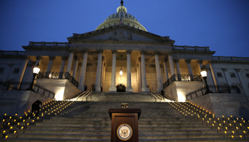 Candles line the US Capitol steps and presidential podium, Washington DC January 6, 2021 (John Lamparski/NurPhoto/Shutterstock)