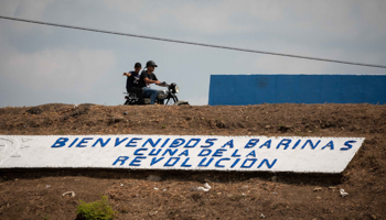 A sign saying "Welcome to Barinas, cradle of the revolution" (Rayner Pena R/EPA-EFE/Shutterstock)