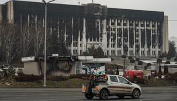 The burned-out hulk of the Almaty city government, a large and iconic Soviet-era building (STR/EPA-EFE/Shutterstock)