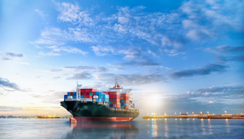An International Container Cargo ship in the ocean (Shutterstock/Aun Photographer)