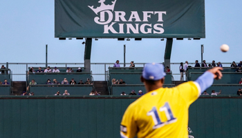 The logo of DraftKings, one of the companies offering online sports betting in New York, at a baseball stadium, September 21, 2021 (Charles Krupa/AP/Shutterstock)