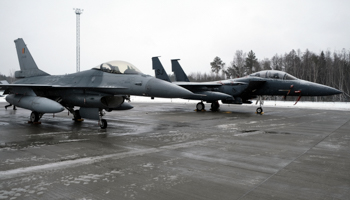 Belgian F-16 (L) and US F-15 fighters on display at the Amari air base, augmenting NATO's Air Policing mission, Estonia, February 1 (Valda Kalnina/EPA-EFE/Shutterstock)