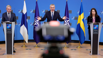 NATO Secretary General Jens Stoltenberg (centre), Finland's Foreign Minister Pekka Haavisto (left) and Sweden's Foreign Minister Ann Linde (right) at NATO headquarters in Brussels (Olivier Matthys/AP/Shutterstock)