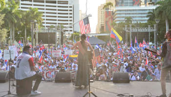 US, Venezuelan and Cuban flags at a rally for freedom in Miami (JLN Photography/Shutterstock)