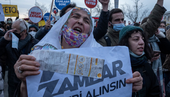 Turks hold placards reading, "Take back the price hikes"  during a protest after annual inflation hits 48.7%, Istanbul, February 20 (ErdemSahin/EPA-EFE/Shutterstock)