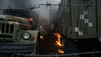A Ukrainian military truck on fire after a Russian strike in Mariupol, February 24 (Evgeniy Maloletka/AP/Shutterstock)