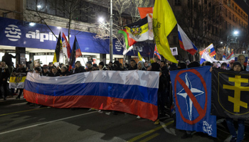 Demonstrators hold a Russian flag during a rally in support of Russian action in Ukraine, Belgrade, March 4 (Marko Drobnjakovic/AP/Shutterstock)