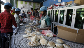 Yemenis buying bread, Sana'a, March 15 (Yahya Arhab/EPA-EFE/Shutterstock)