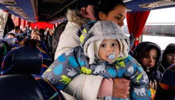 A Ukrainian refugee family take their seats in a coach leaving for Poland, Lviv, April 5 (Dominika Zarzycka/NurPhoto/Shutterstock)