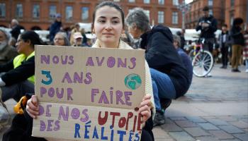 A demonstrator highlights the three-year time window noted in the latest IPCC report. Toulouse, April 9 (Alain Pitton/NurPhoto/Shutterstock)