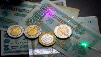 Algerian dinar banknotes and coins. (Shutterstock)