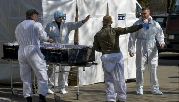 French experts move bodies found in Bucha, Ukraine, April 29 (Andrii Nesterenko/EPA-EFE/Shutterstock)